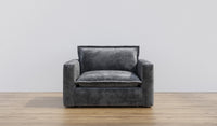 a sleek and modern armchair or loveseat in a deep, textured gray upholstery